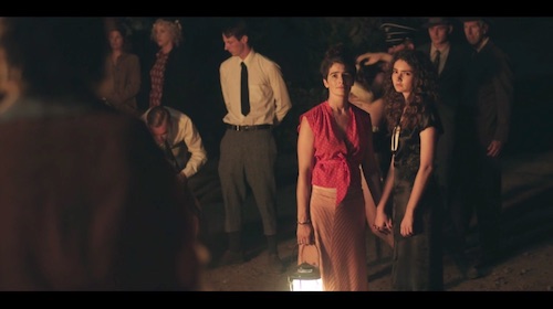 Ali and young Grandma Rose hold hands as they look toward Gittel. Screenshot taken by the author.